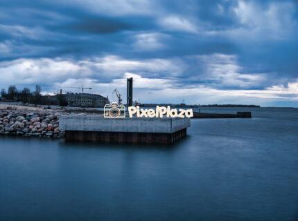 Tallinn Waterfront with Cranes and Cloudy Sky